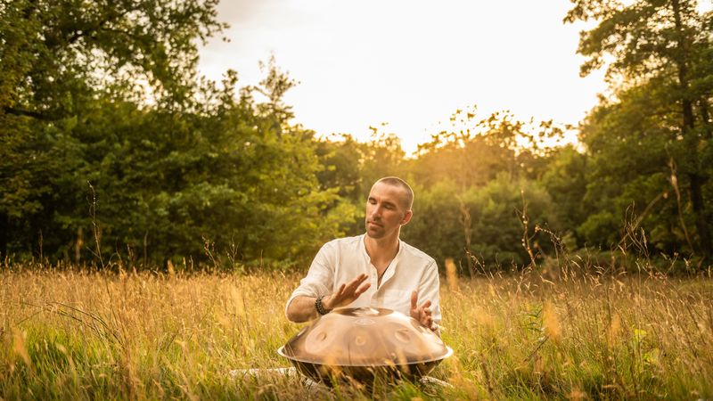 Handpan and instruments laid out in a field